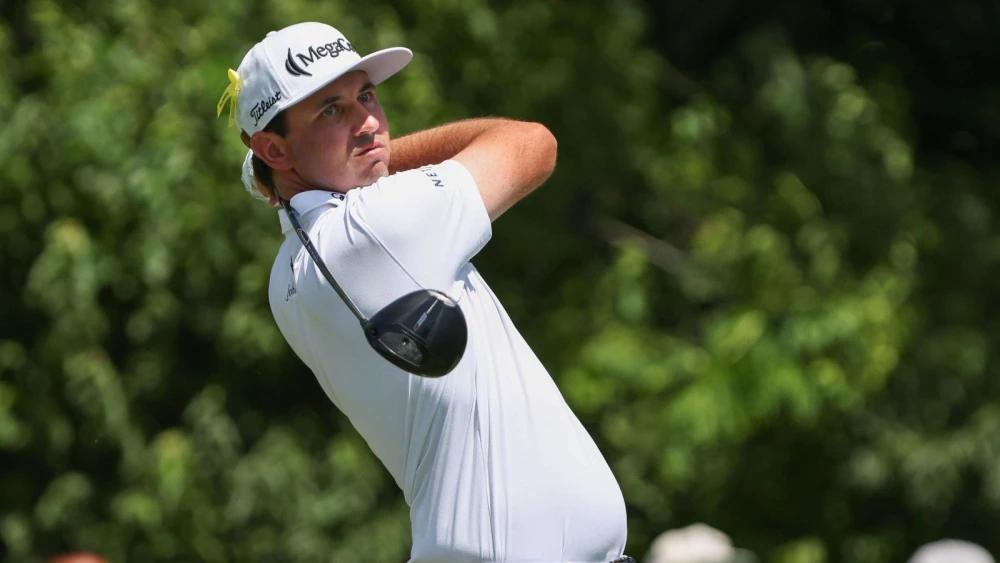 JT Poston surges clear at Memorial as Rory McIlroy and Scottie Scheffler struggle