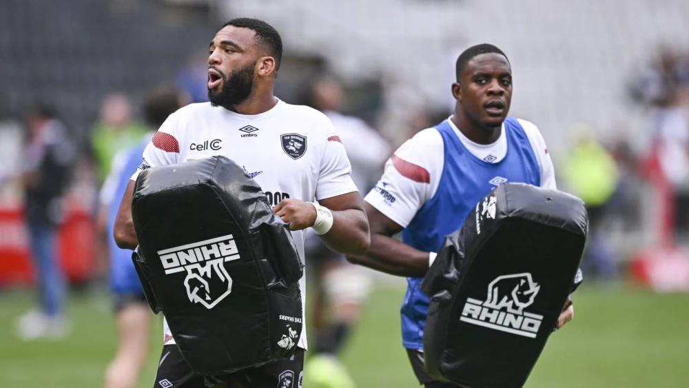 Brothers in Arms: Emmanuel and Vincent Tshituka embracing Saturday's special moment