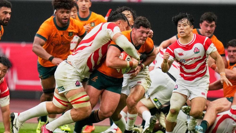Australia survive major upset with rain-soaked win over Japan in Tokyo